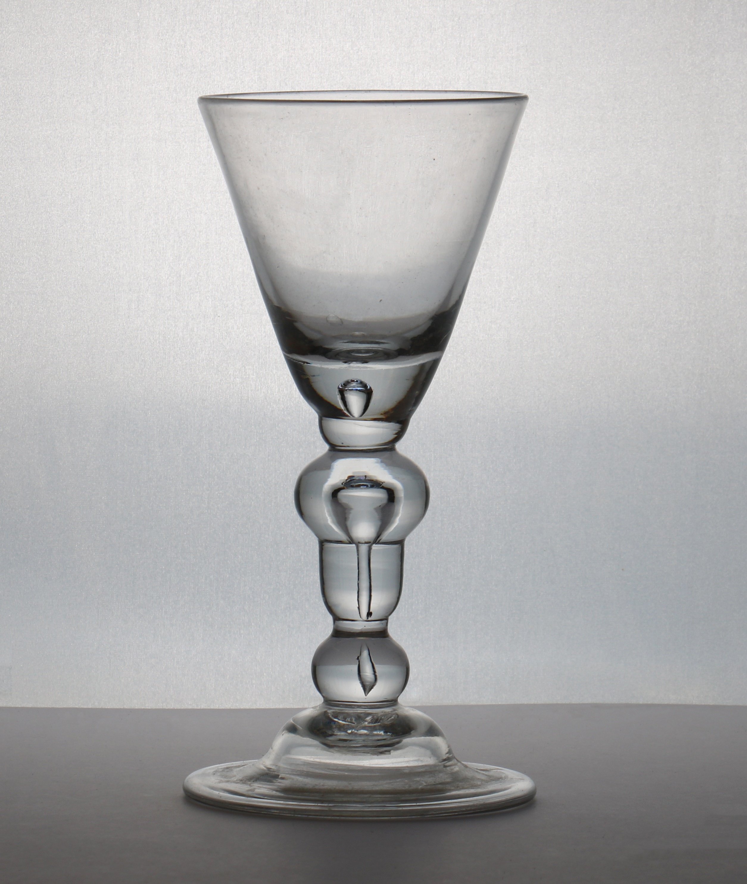 A heavy baluster wine glass goblet (£1,500-2,500)